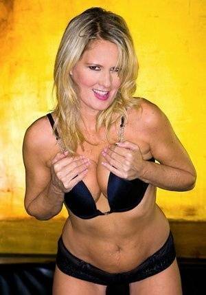 Blond MILF Bridgett Lee flaunting with her tits and big ass exposed on fanspics.com