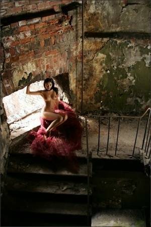 Slim brunette with a great ass models totally naked in deserted building on fanspics.com