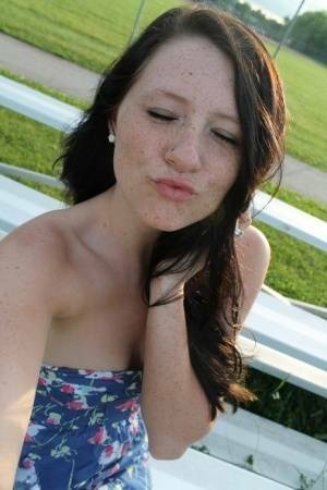 Teen solo girl Freckles 18 exposes her upskirt panties at a ball diamond on fanspics.com