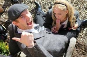 Blonde schoolgirl Loulou licks and sucks a huge dick while outdoors on fanspics.com