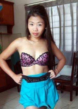 Cute Filipina girl strips naked in the confines of a sex tourist on fanspics.com