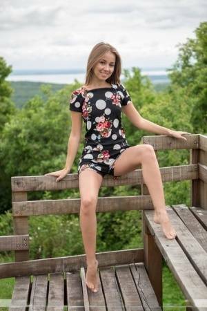 Barefoot teen Linda A gets totally naked at a lookout spot in the woods on fanspics.com