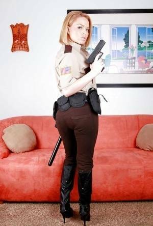 Hot babe in police uniform Krissy Lynn stripping and spreading her legs on fanspics.com