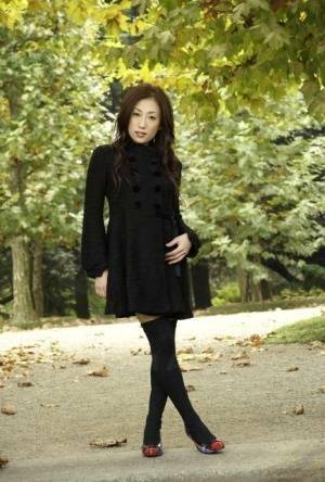 Fully clothed Japanese teen models in the park in black clothes and stockings - Japan on fanspics.com