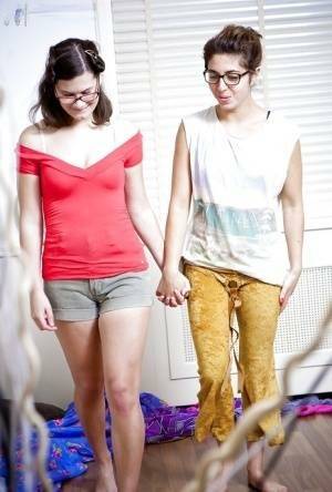 Glasses wearing lesbians Sabina M and Tallulah dress hairy twats on fanspics.com