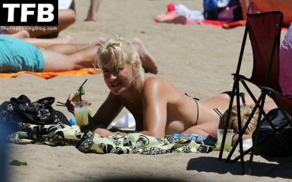 Sarah Connor Flashes Her Nude Breasts on the Beach on fanspics.com