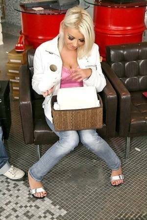 Pliable blonde chick scrunches up to give the shoe salesman a footjob on fanspics.com