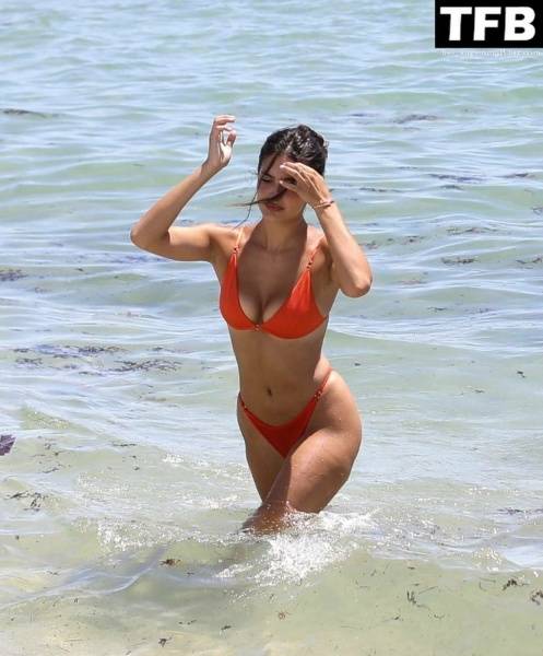 Tao Wickrath Stuns in Small Orange Bikini on the Beach in Miami on fanspics.com