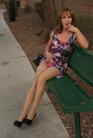 Aged lady flashes her tits and twat on a public bench before disrobing at home on fanspics.com