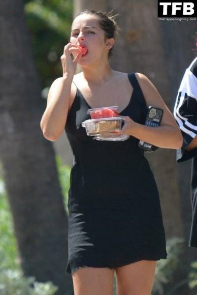 Addison Rae Indulges in Some Refreshing Watermelon While Out in a Tight Skirt with Her Boyfriend on fanspics.com