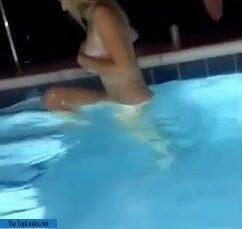 Unhinged teen jumps into pool topless on fanspics.com