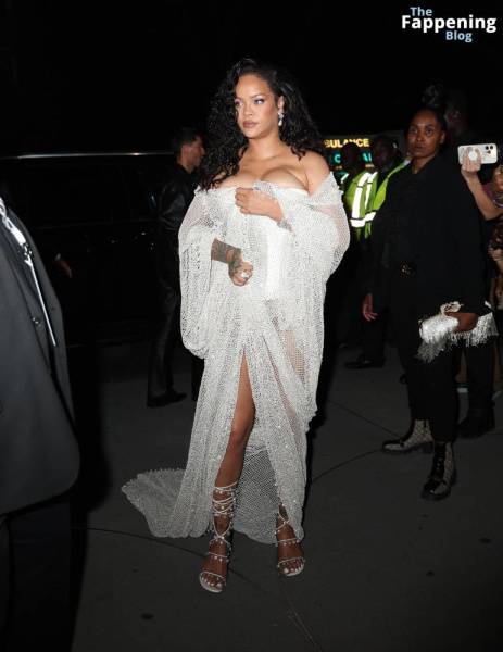 Rihanna Displays Her Curves in a White Dress (13 Photos) on fanspics.com